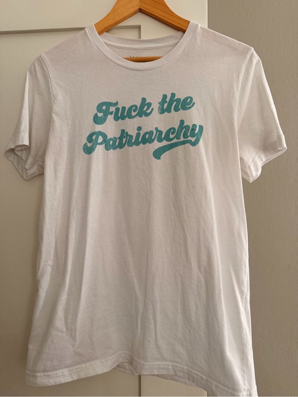 White Short Sleeve Tee with Teal F the Patriarchy Slogan